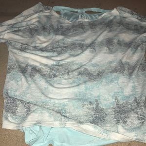 Blue justice shirt with tank top underneath